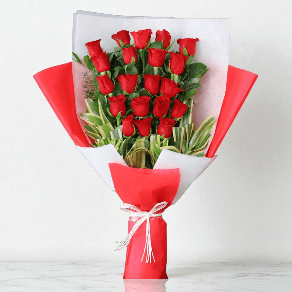 IMG_7707 (2) - Copy Red roses bouquet in red and white designer paper wrap with ribbon bow