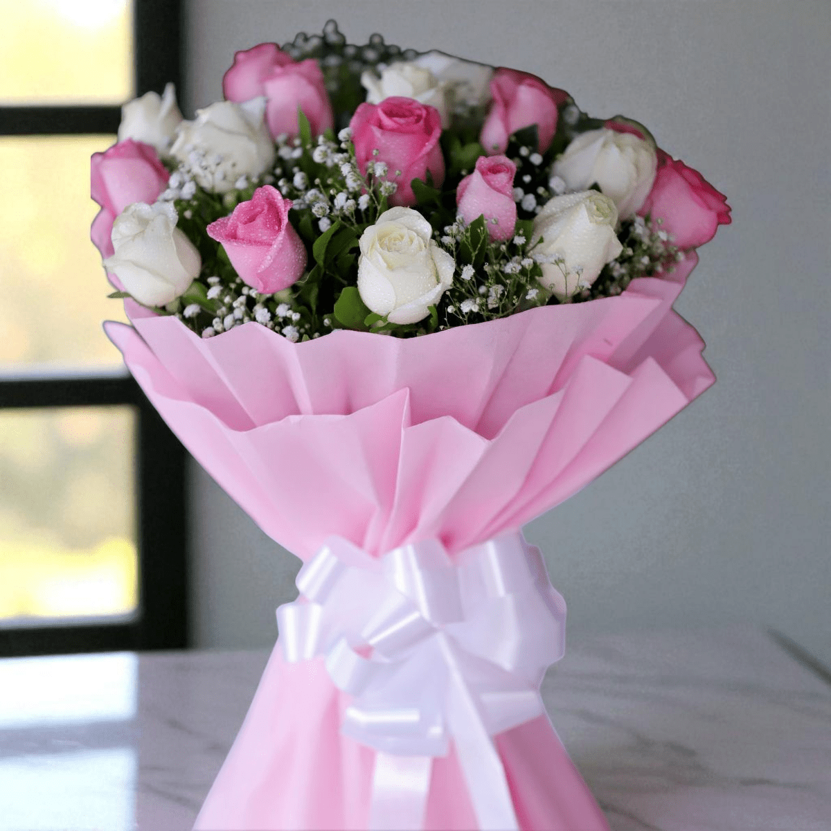 IMG_7850 (2) Pink and white roses bouquet wrapped in pastel pink paper with white ribbon