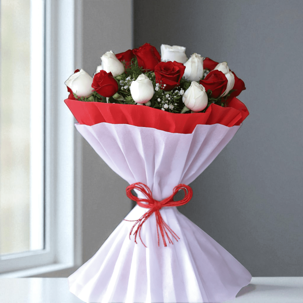 20 red and white roses bouquet wrapped in dual-tone red and white paper with ribbon bow