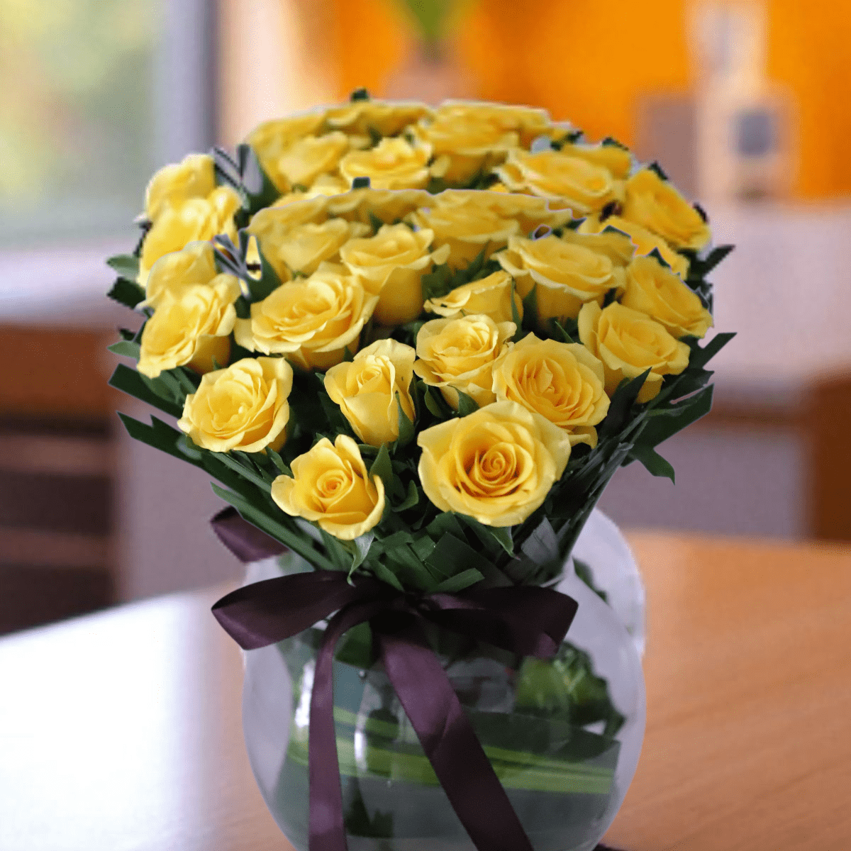 Yellow Roses Vase Arrangement arrangement of 20 vibrant yellow roses, beautifully set in a round glass vase - YHOJA.COM