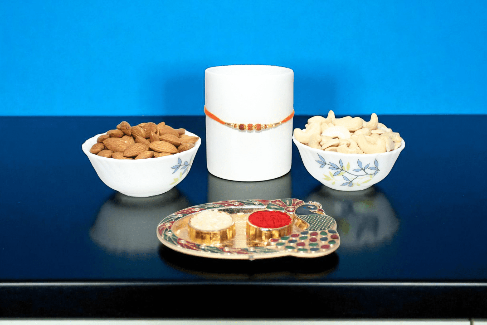 Rakhi With Dry Fruit sacred Rudraksha Rakhi paired with a premium dry fruit combo - YHOJA.COM