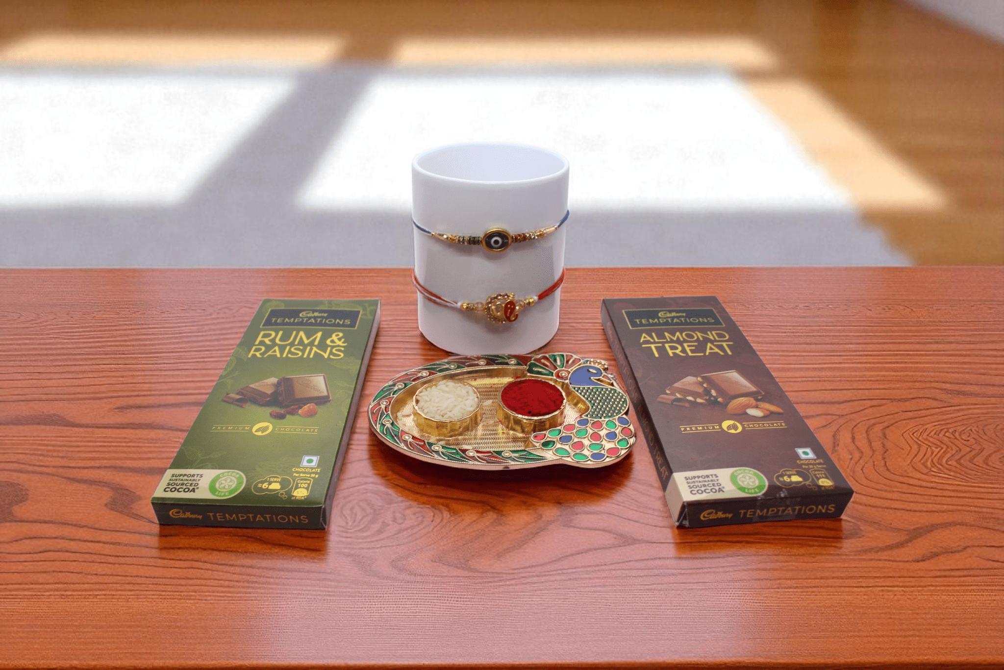 Rakhi With Chocolate Evil Eye & Ganpati Rakhi with Temptations Chocolate Set - YHOJA.COM