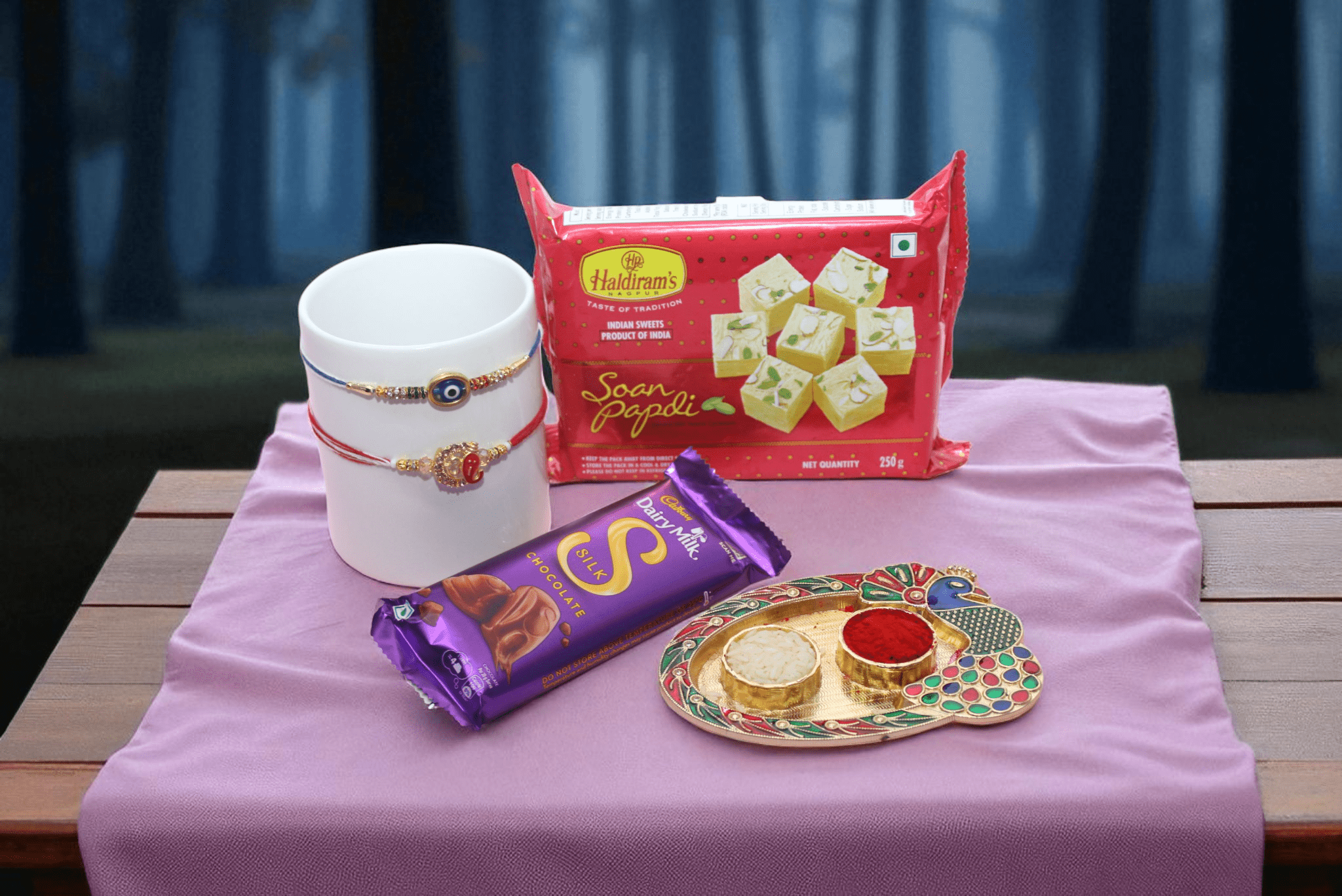 1 Evil Eye Rakhi and 1 Ganpati Rakhi, Chocolate & Sweet