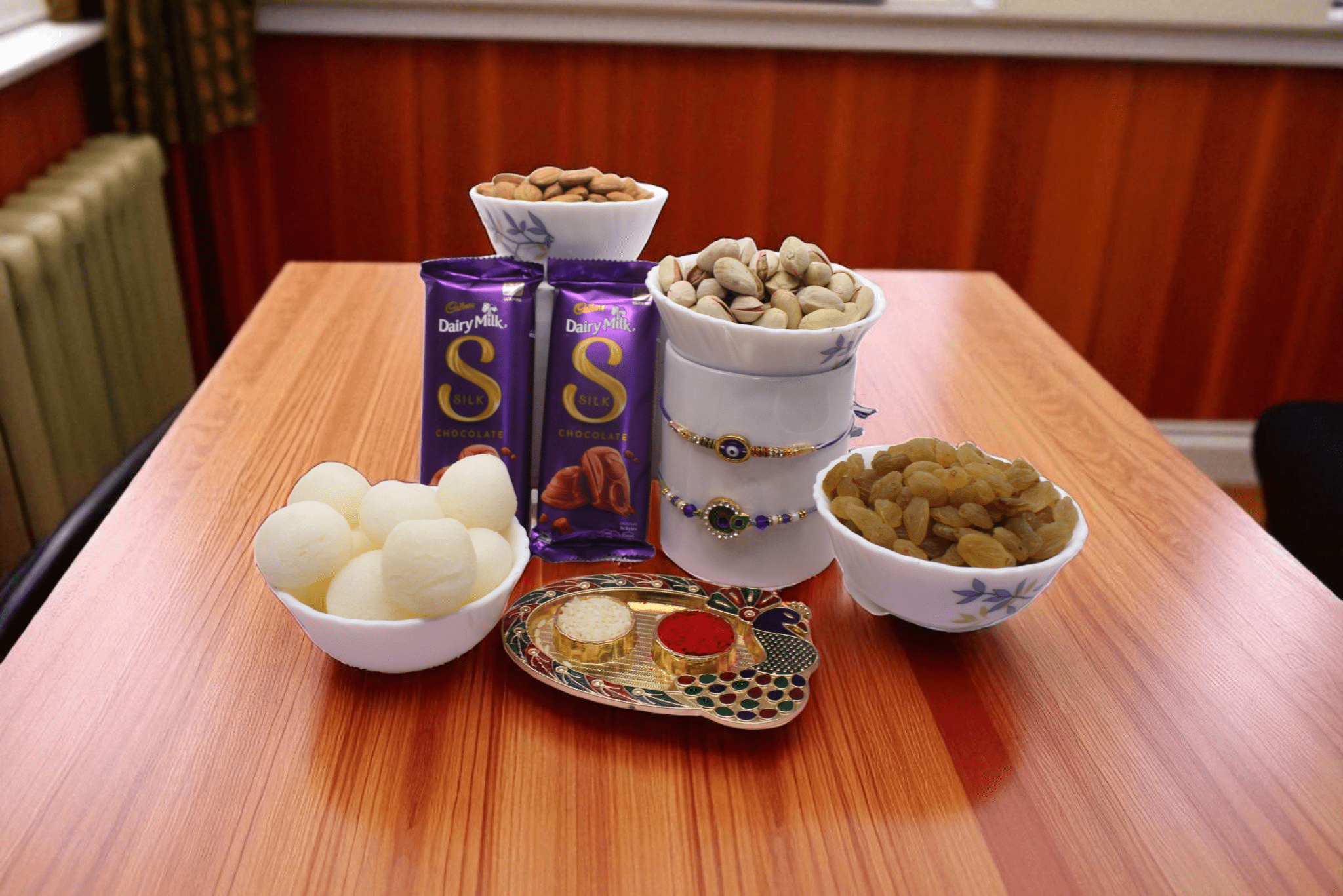 Rakhi With Rasgulla, dry fruit, chocolate Divine Rakhi Celebration Hamper