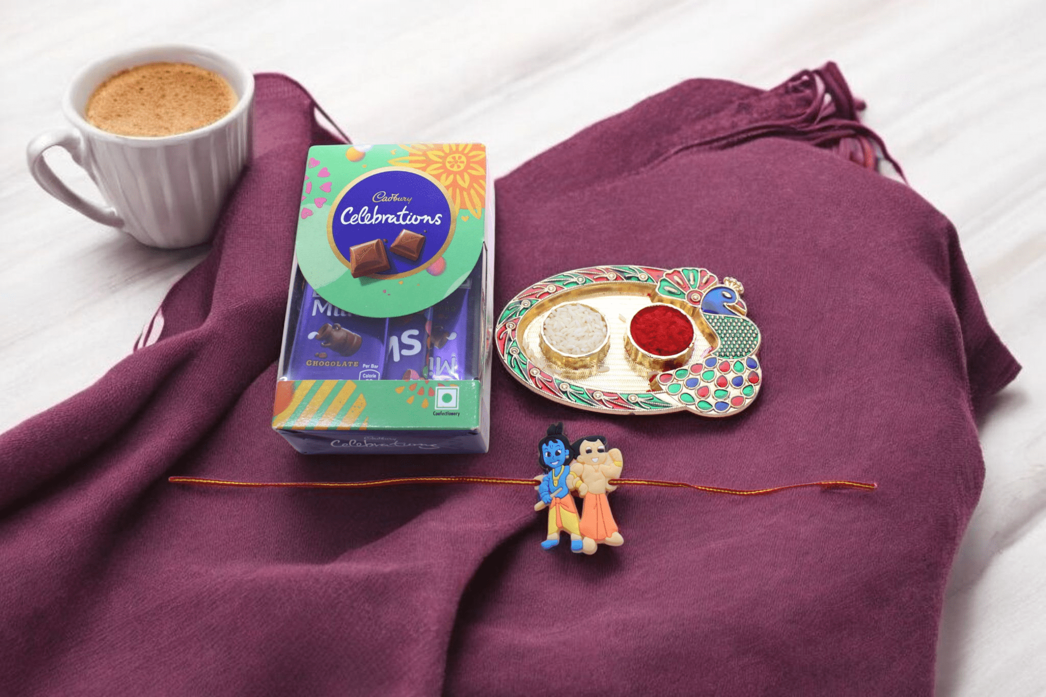 Rakhi With Chhocolate Kid Rakhi paired with everyone's favorite Cadbury Celebrations mini chocolate box.