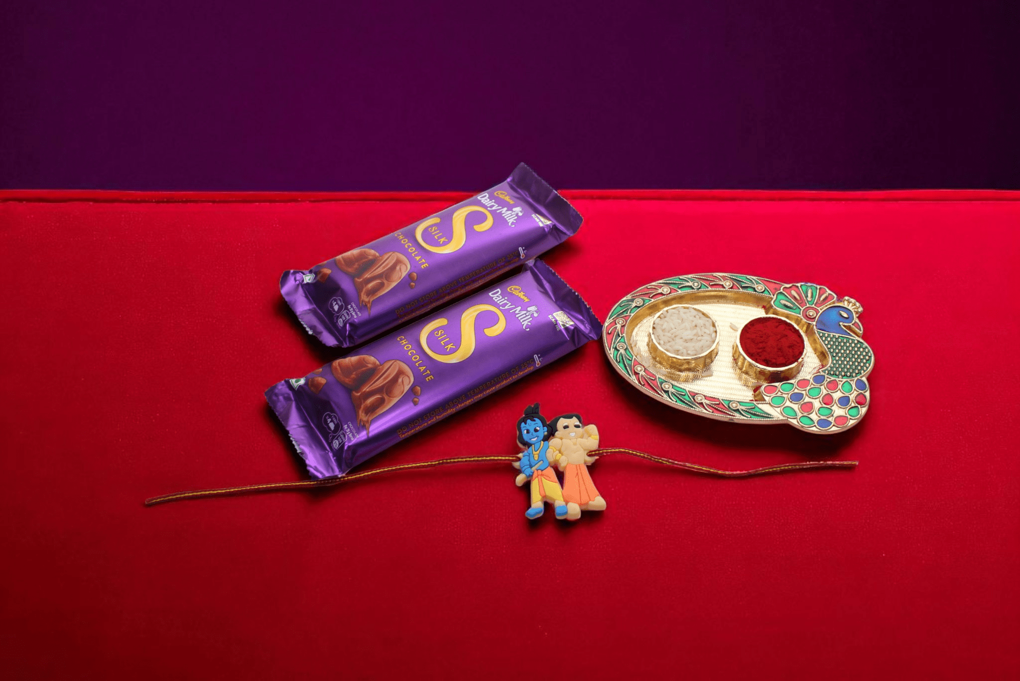 IMG_8674 This charming Rakhi features an adorable Krishna cartoon Rakhi, two Cadbury Dairy Milk Silk chocolate bars - YHOJA.COM