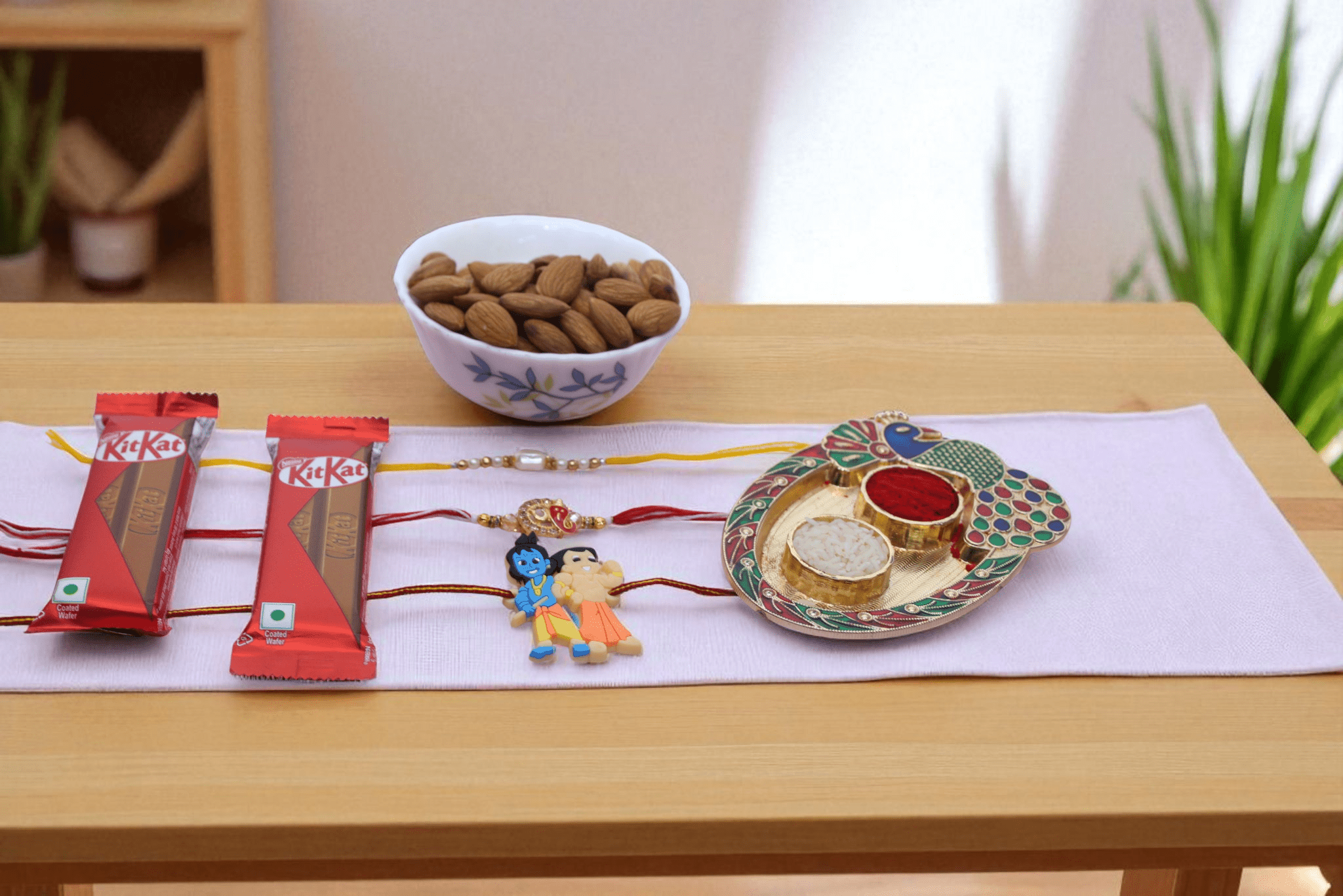 Trinity Delight Rakhi Hamper Trinity Delight Rakhi Hamper with Ganpati Rakhi, Kid Krishna Rakhi, Pearl Rakhi, KitKat Chocolate Bars and Premium Almonds