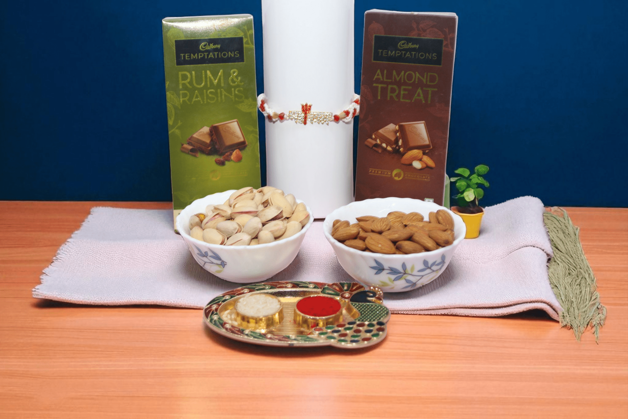 Mahakal Dry Fruit Chocolate Hamper with Mahakal Rakhi, Cadbury Temptations, Almonds, Pistachios and Roli Chawal