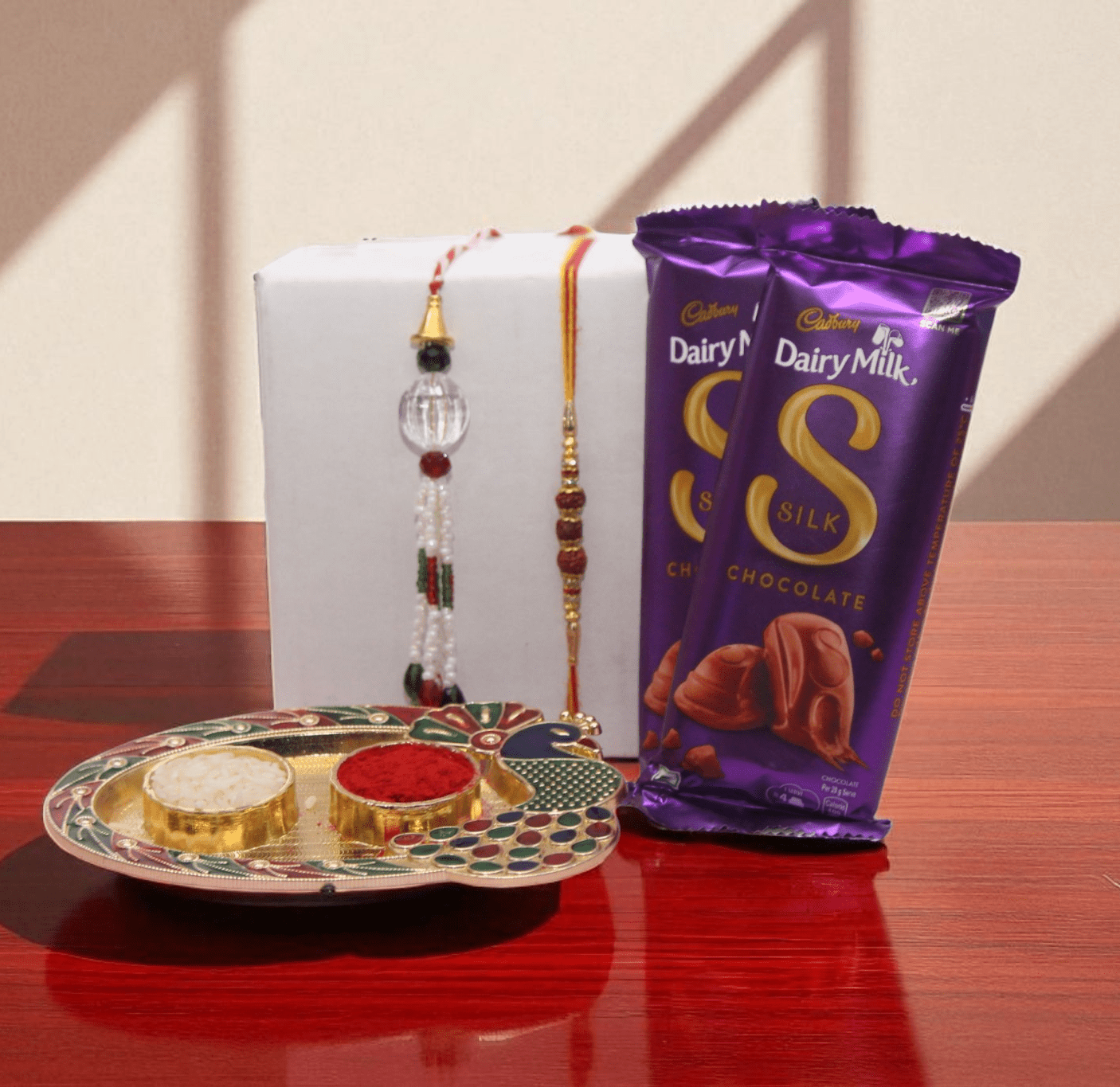 Couple Silk Chocolate Rakhi Hamper with Cadbury Dairy Milk Silk, Bhai Rakhi and Lumba Rakhi