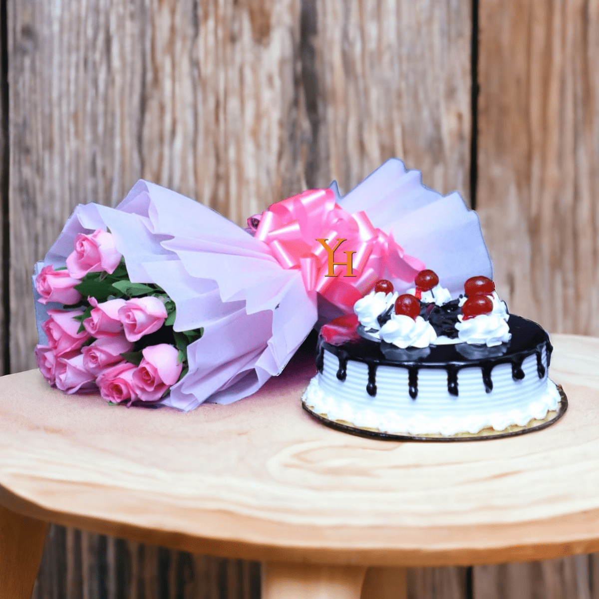 Pink Roses with Black Forest Cake combo featuring bouquet of pink roses and fresh cake with cherries.