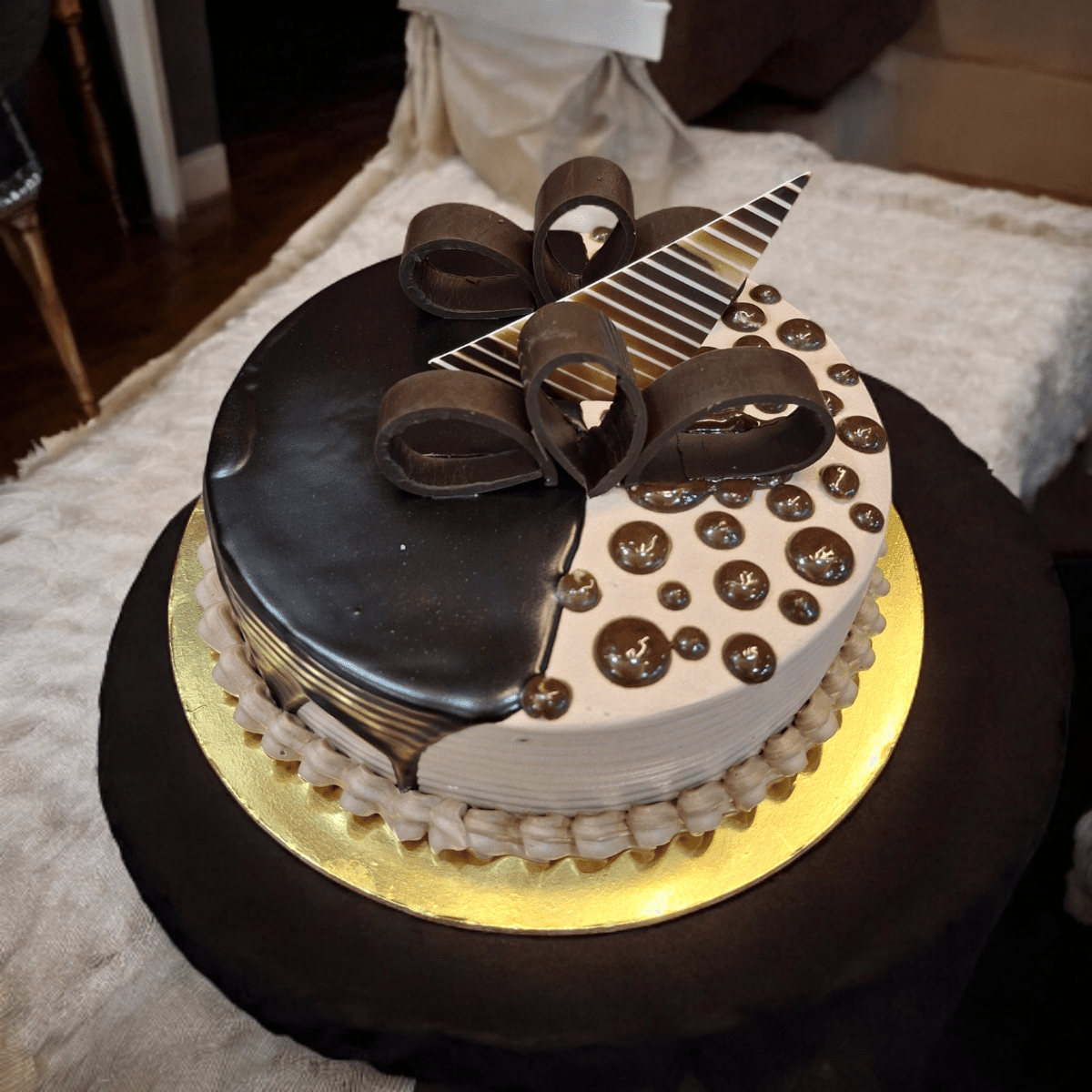 Delight Choco Drop Cake with glossy glaze, chocolate toppings, and designer finish.
