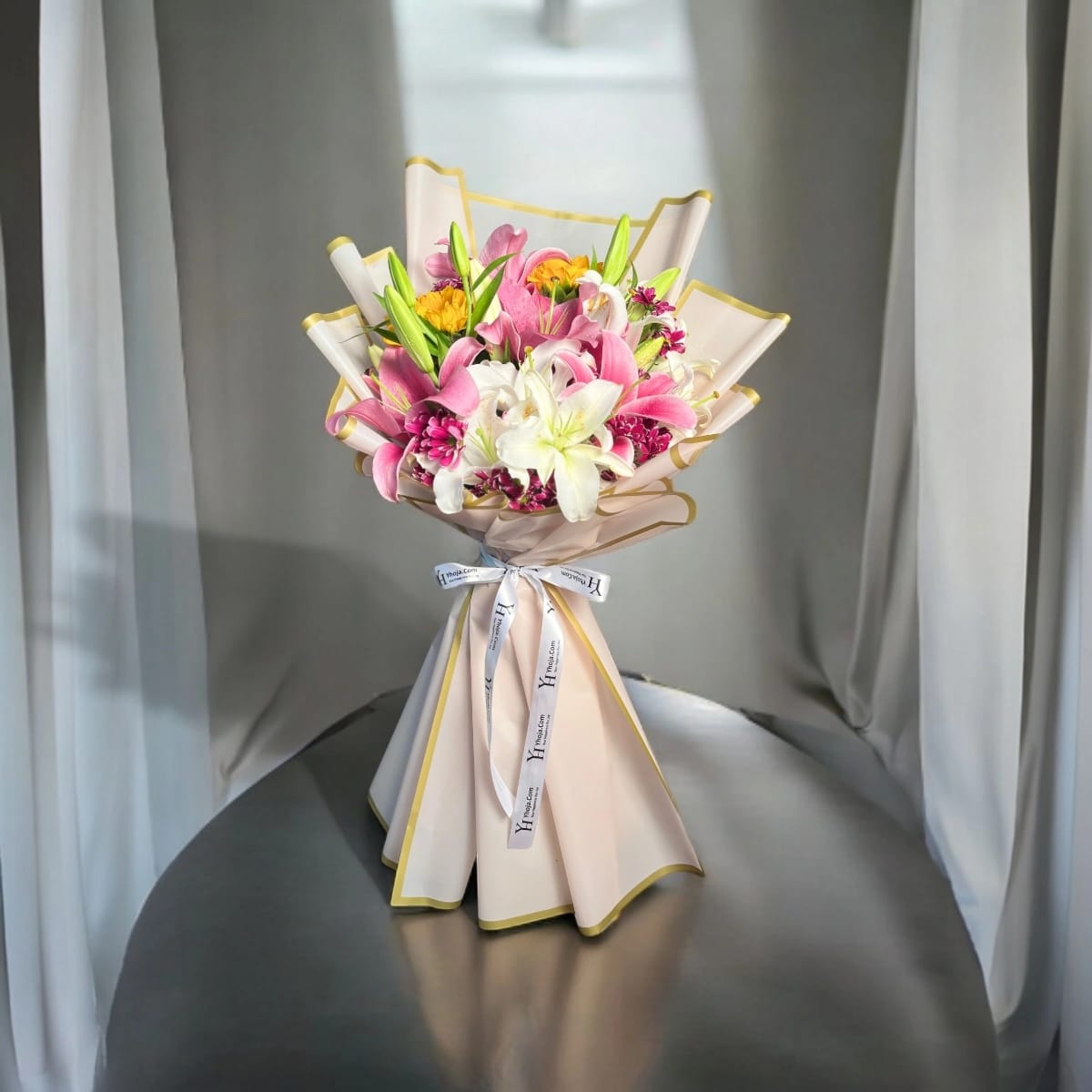 Pastel bouquet with lilies, Daisy, and sunflower in elegant wrap