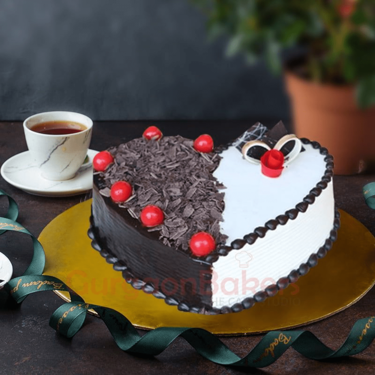 black forest heart shape. Heart Bliss Choco-Vanilla Cake decorated with chocolate shavings, cherries, and vanilla frosting.